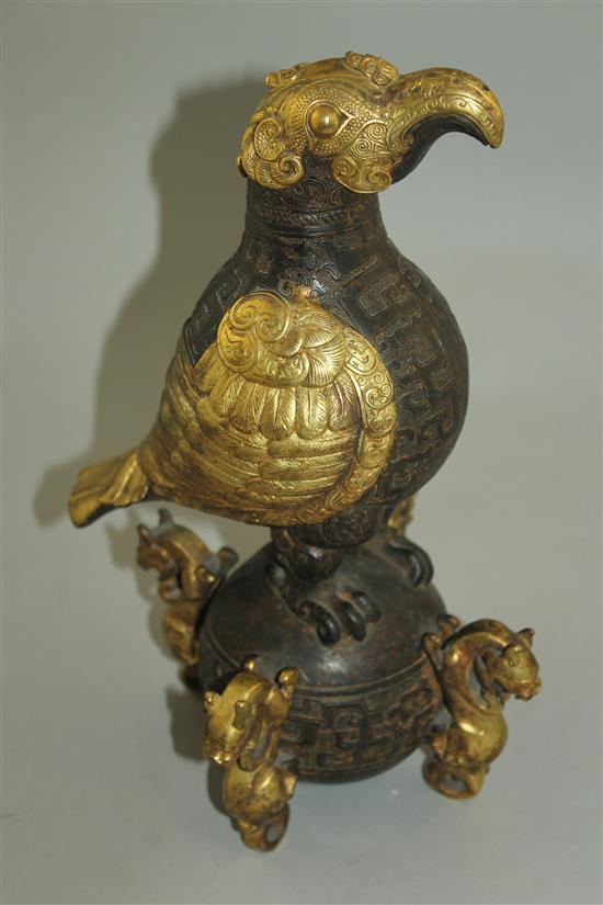 A Chinese part gilt bronze model of an eagle, in Han dynasty style, 29.5cm